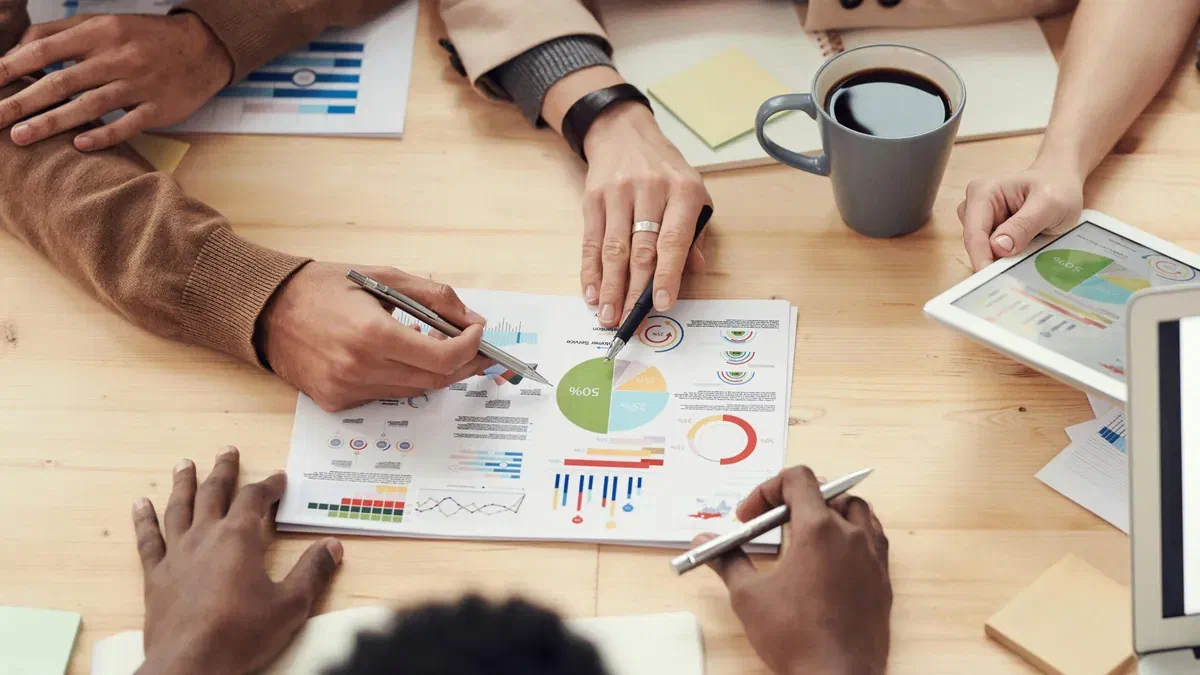 People reviewing financial charts together at a table